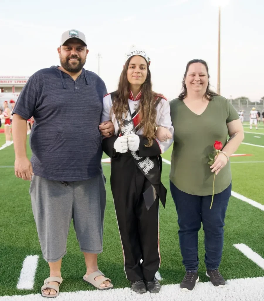 Portrait of Walker, Vero Beach tile and flooring specialist, standing outdoors with family.